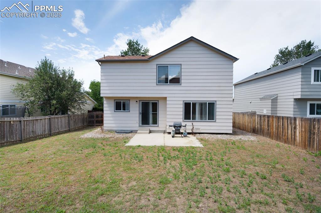 Image 36 of 37: Concrete patio, spacious yard