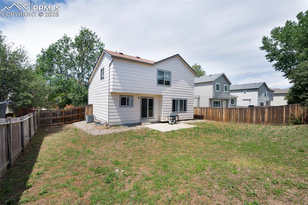 Image 37 of 37: Concrete patio, spacious yard