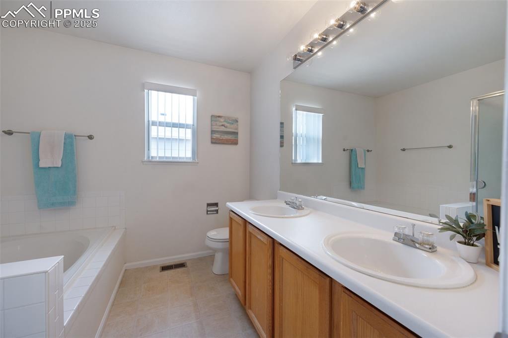 Image 4 of 37: Five piece master bathroom