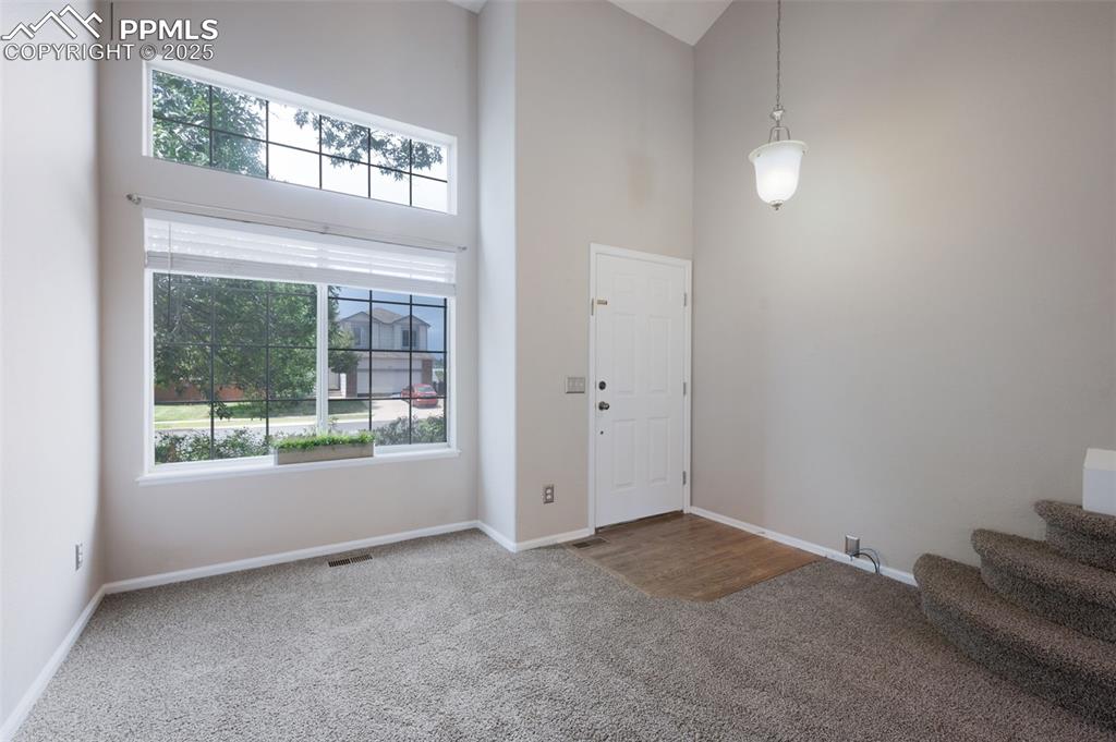 Image 6 of 37: 9+ foot ceilings, new carpet, new trim paint