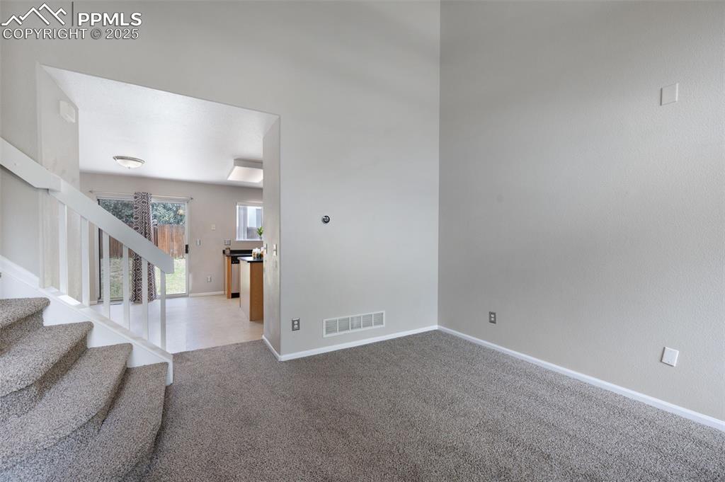 Image 7 of 37: 9+ foot ceilings, new carpet, new trim paint