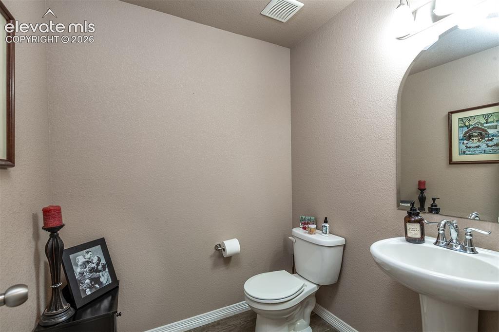 Image 18 of 45: Main-level powder room
