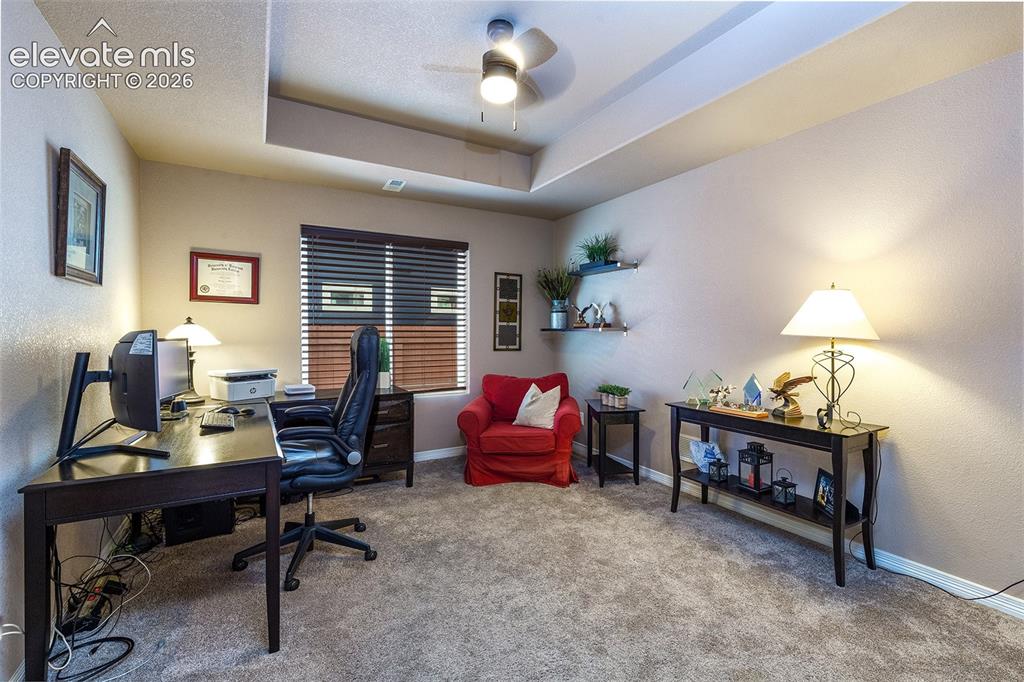 Image 19 of 45: Main-level bedroom/office