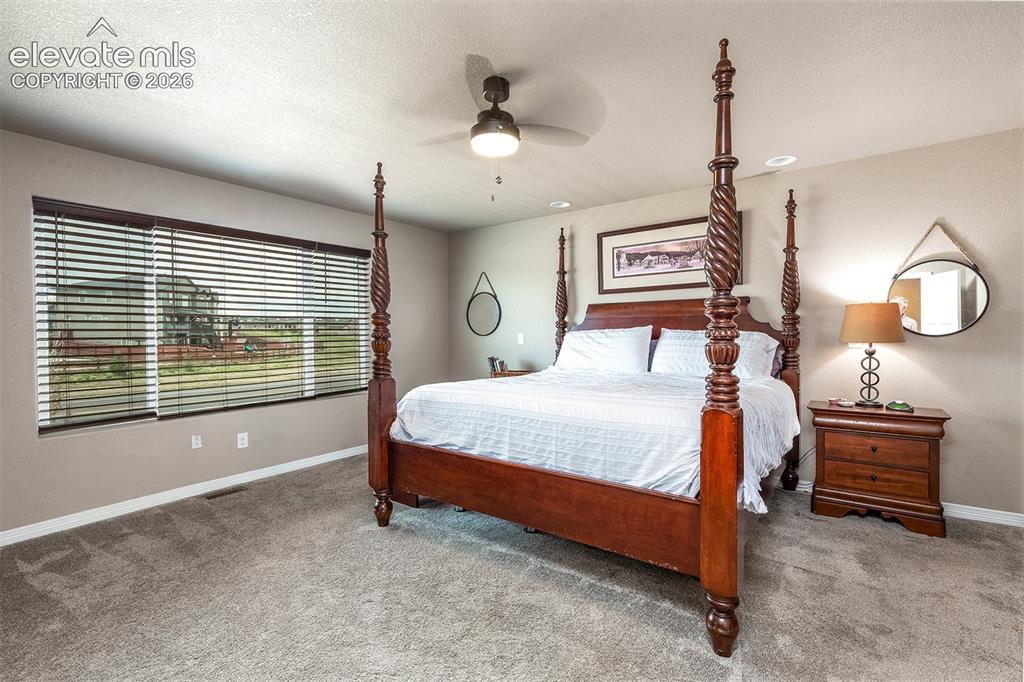 Image 24 of 45: Retreat to the spacious primary suite, with a relaxing 5-piece ensuite bath