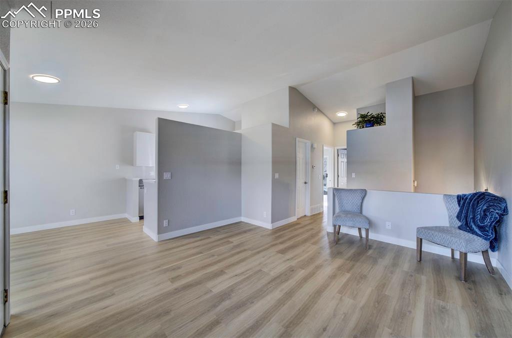 Image 5 of 33: Vaulted ceiling, new paint and new flooring throughout!