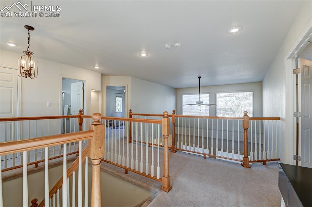 Image 30 of 49: Walkway on the Upper Level, Overlooking the Living Room.
