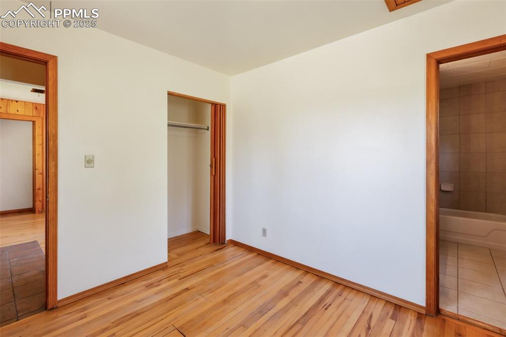 Image 29 of 35: Unfurnished bedroom featuring light wood-type flooring and a closet
