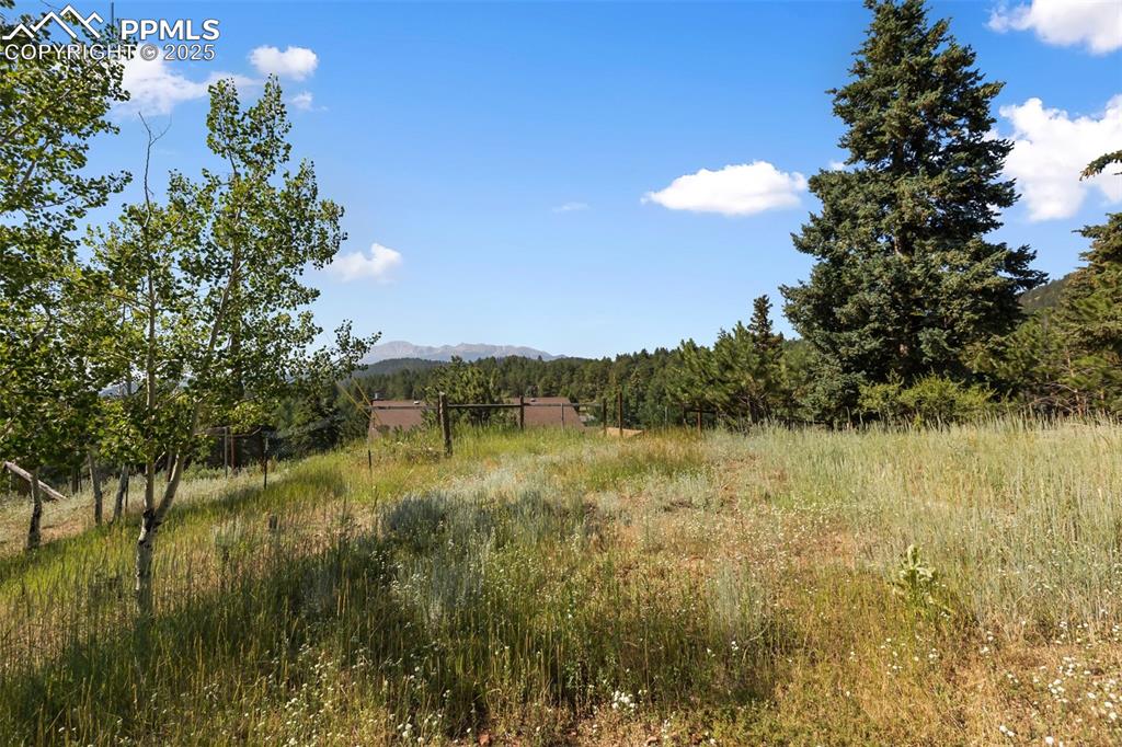 Image 33 of 35: View of nature featuring a mountain backdrop and rural landscape