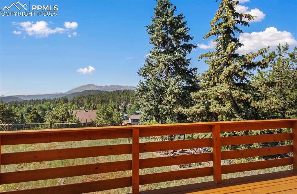 Image 6 of 35: Mountain view with a heavily wooded area