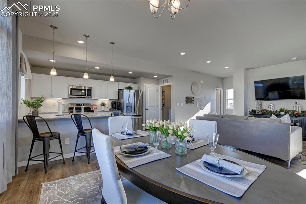 Image 10 of 23: **Photos of previous model home of same floor plan