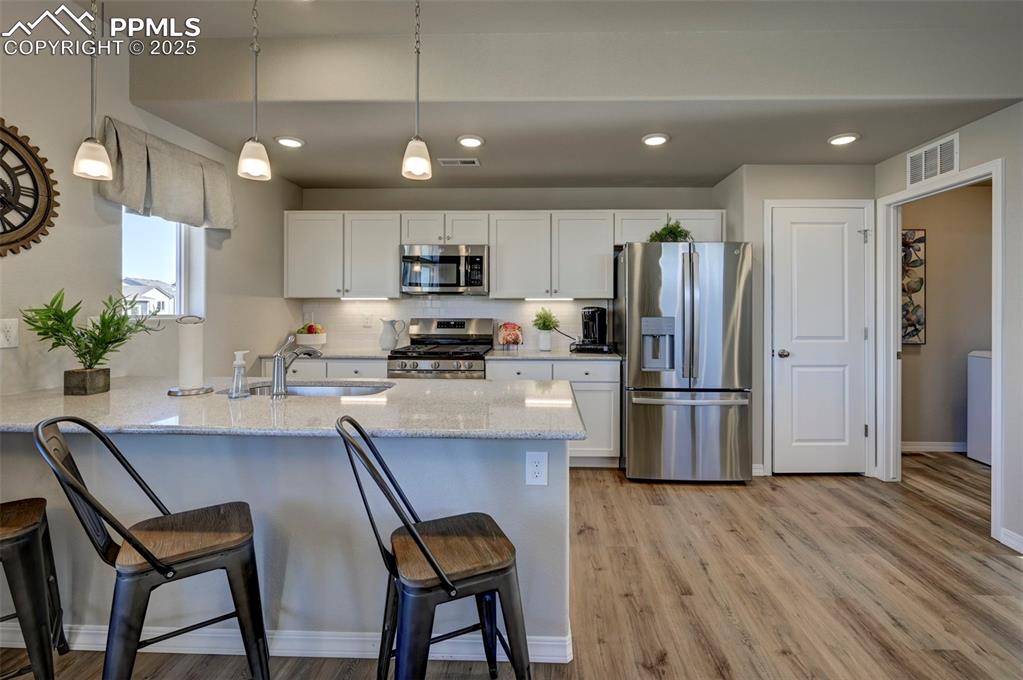 Image 11 of 23: **Photos of previous model home of same floor plan