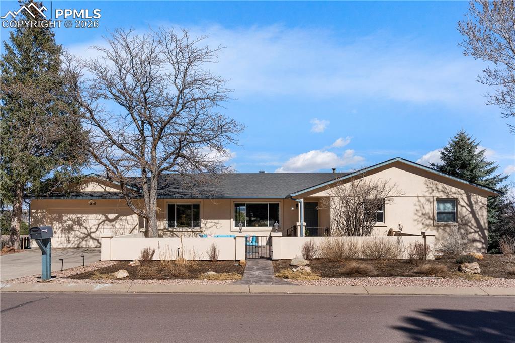 Image 1 of 46: Stucco exterior, 2 car garage and fully enclosed courtyard,