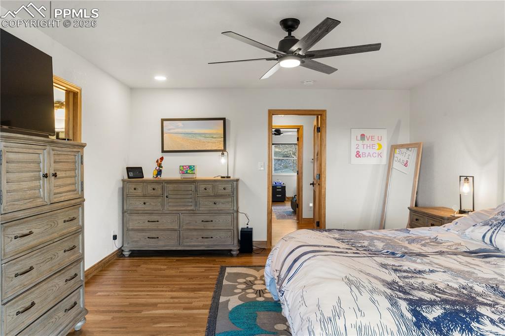 Image 23 of 46: Hardwood flooring and attached 3/4 bath