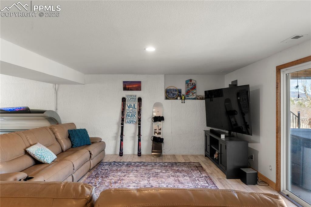 Image 28 of 46: Family room space in the basement.