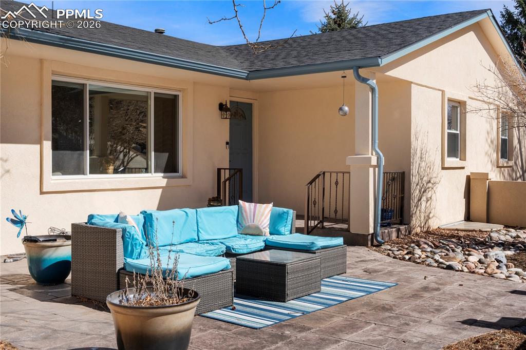 Image 3 of 46: Courtyard and covered front porch.