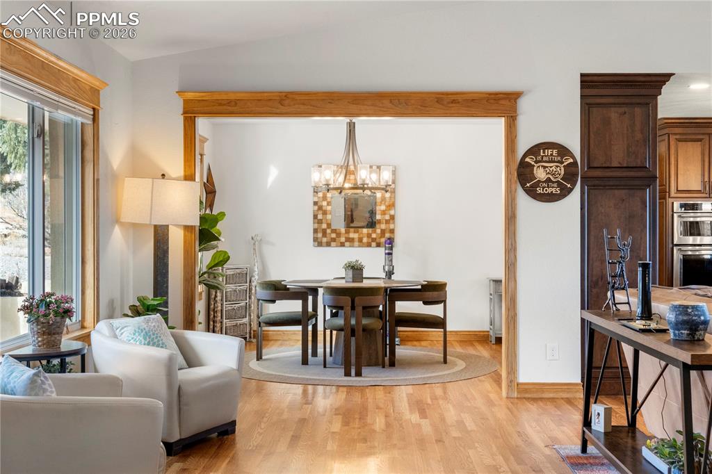 Image 4 of 46: Just off the entry is a seating area. Large picture window and tons of natu