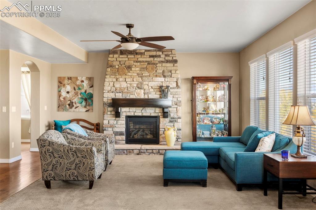 Image 10 of 41: Living room with healthy amount of natural light, arched walkways, ceiling