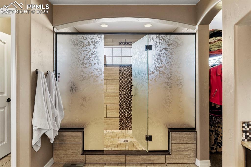 Image 26 of 41: Bathroom with a large walk in shower