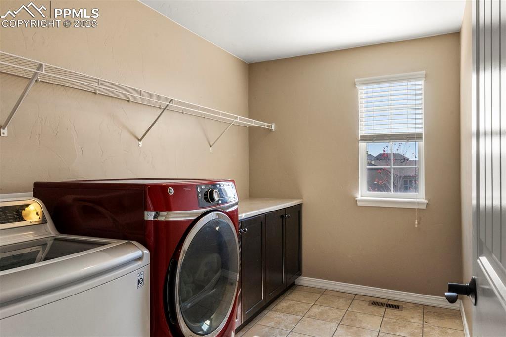 Image 33 of 41: Laundry area, cabinet space