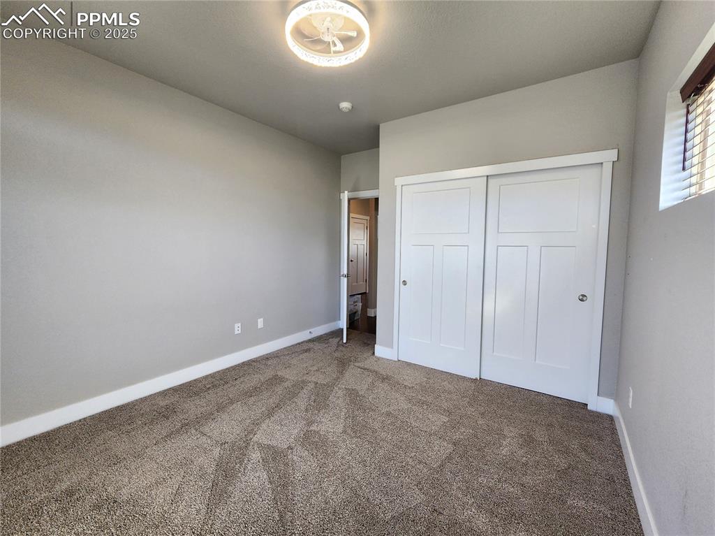 Image 16 of 50: main-level second bedroom-idea for guests, a home office, or flex space