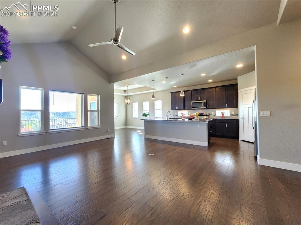 Image 3 of 50: spacious open-concept layout showcasing the seamless flow between the livin