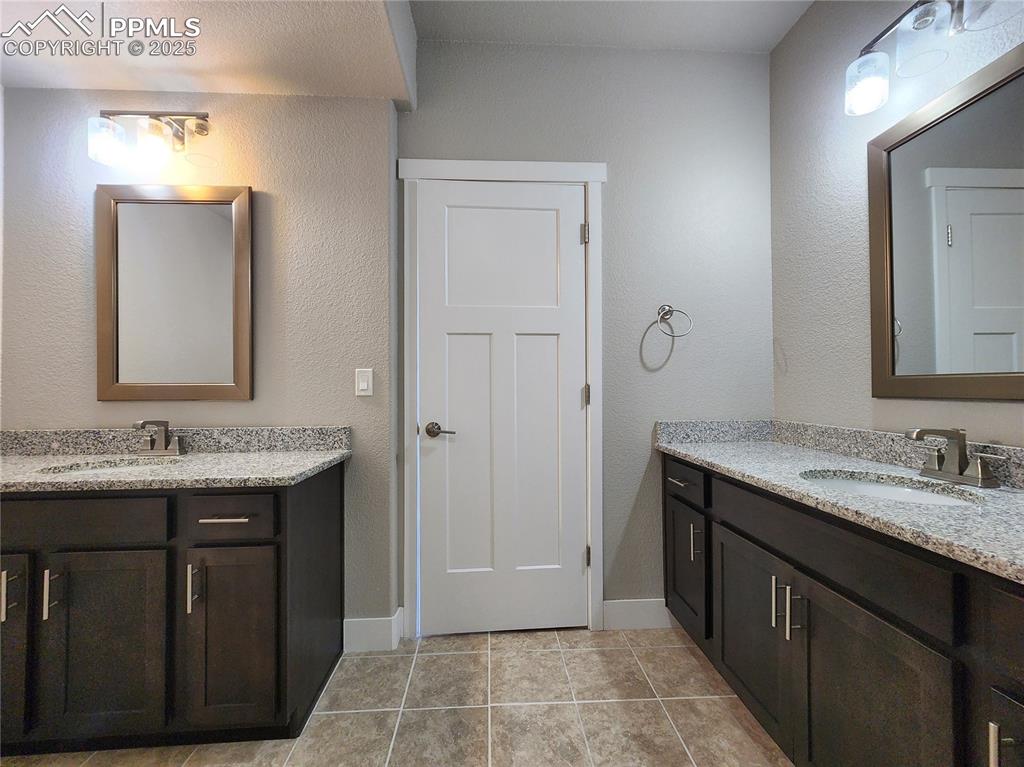 Image 34 of 50: basement bathroom with spacious separate double vanity