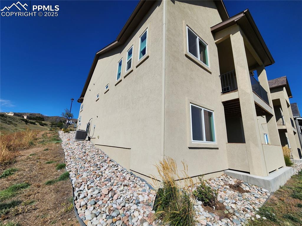 Image 37 of 50: charming back corner view of the home