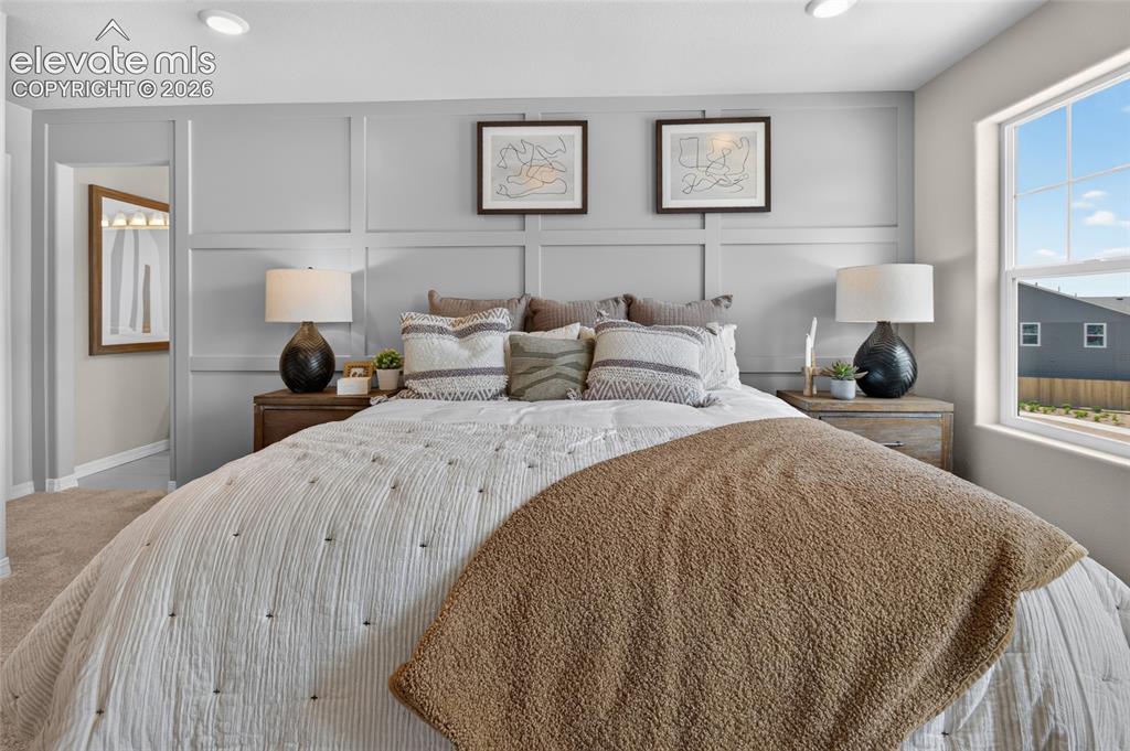 Image 23 of 45: Spacious room featuring board and batten wall detailing, recessed lighting,
