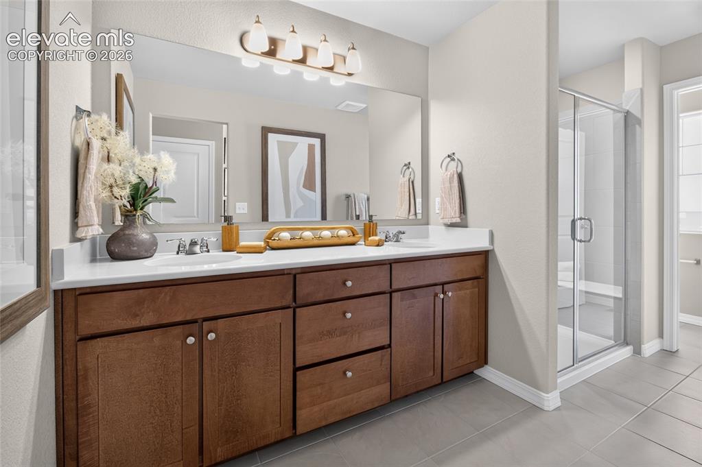 Image 27 of 45: Spacious room featuring neutral carpeting, recessed ceiling lights, and two