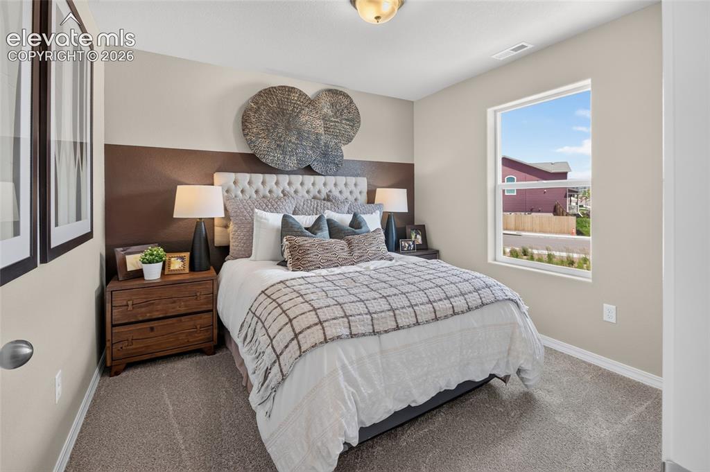 Image 34 of 45: Carpeted loft space featuring shiplap accent walls, recessed lighting, and