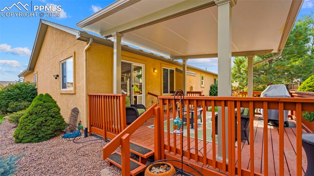 Image 27 of 33: Wooden deck featuring grilling area