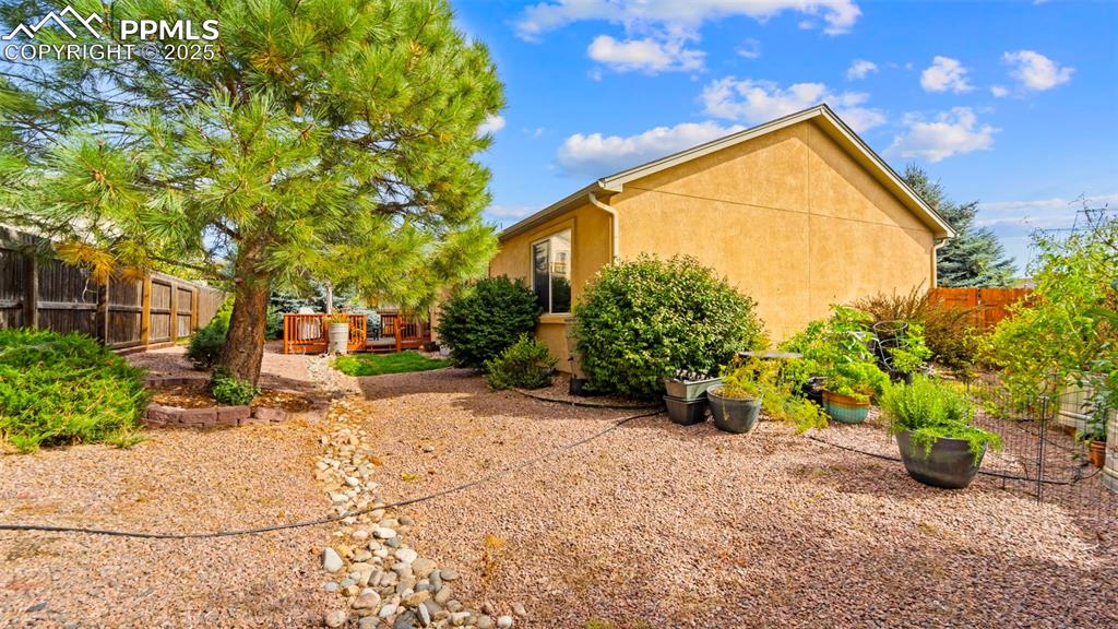 Image 28 of 33: View of fenced backyard
