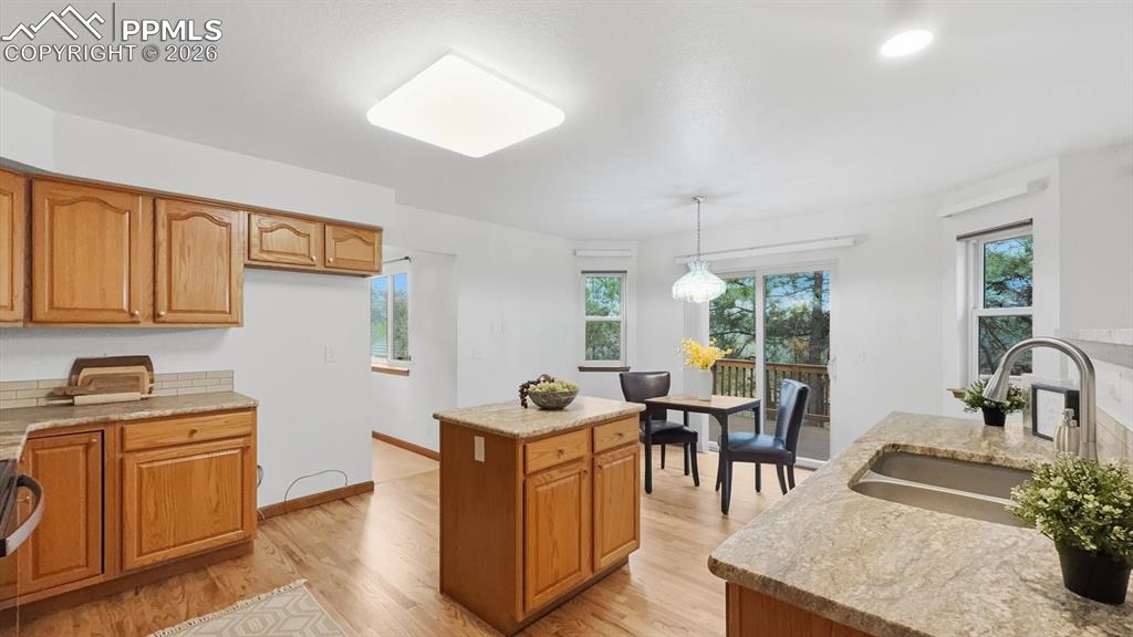 Image 16 of 47: The living room flows seamlessly into the formal dining room.