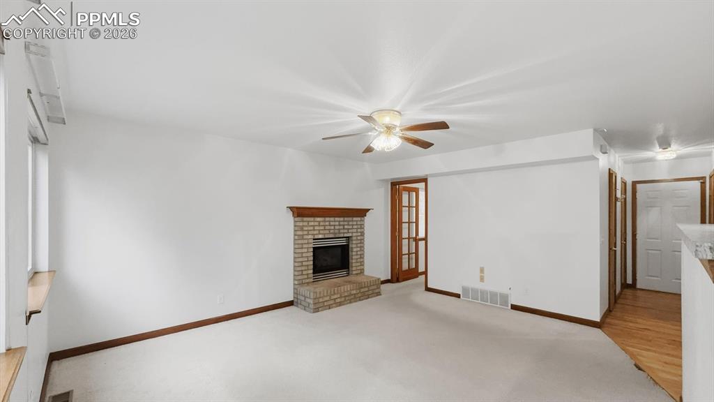 Image 19 of 47: Enjoy cozy Colorado evenings gathered in the family room around a gas firep