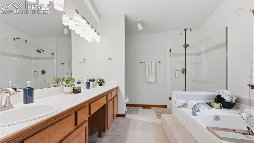 Image 29 of 47: Upper Level Full Bathroom with tiled tub/shower.