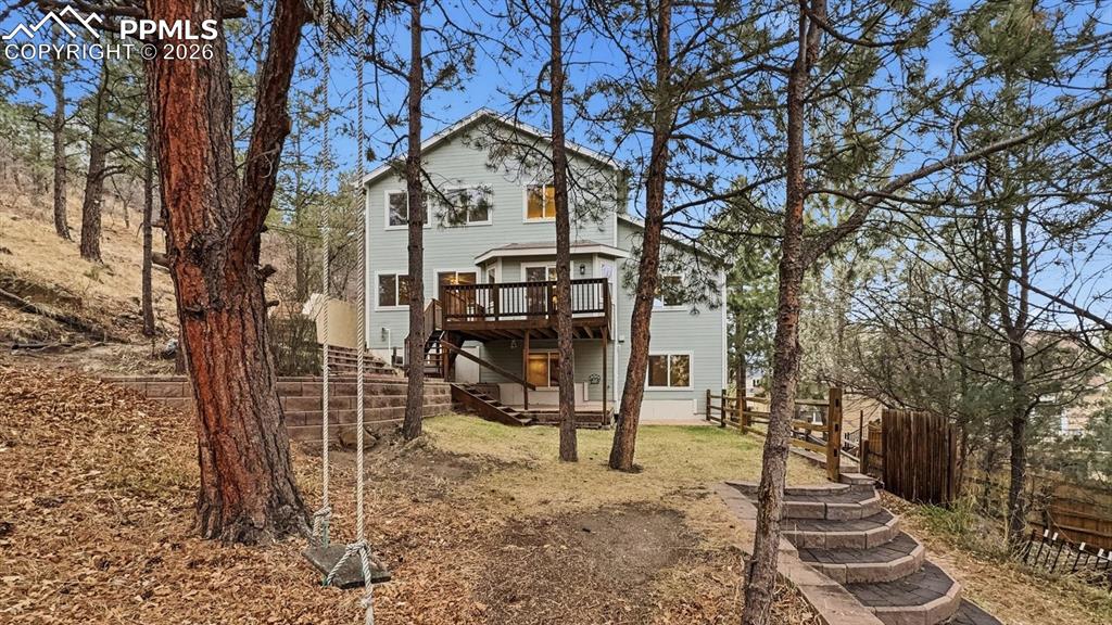 Image 44 of 47: Covered flagstone patio to enjoy the fresh Colorado air and sunshine.