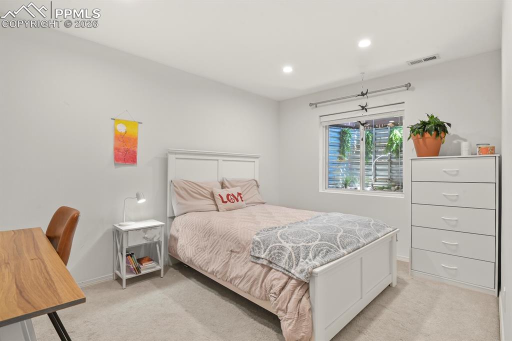 Image 23 of 34: Lower 3rd bedroom with walk in closet