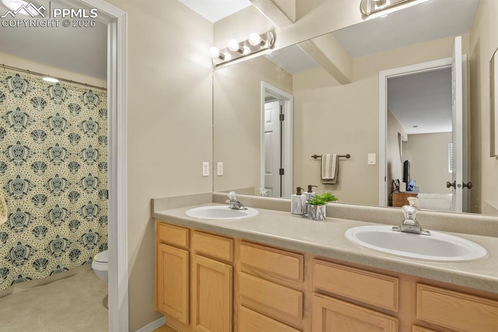 Image 24 of 34: Lower level with two sinks