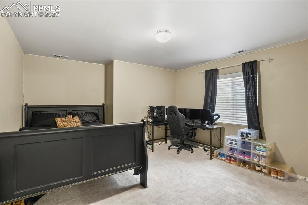 Image 25 of 34: Lower level 4th bedroom with walk in closet