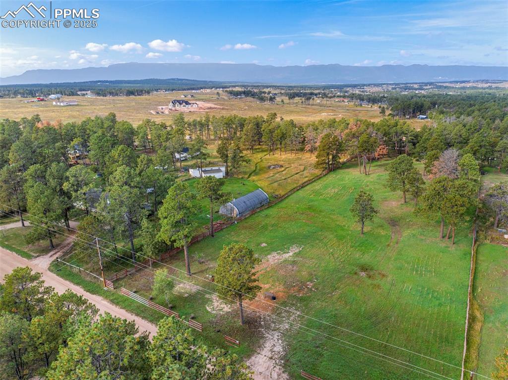 Image 9 of 9: View of rural area featuring a mountainous background