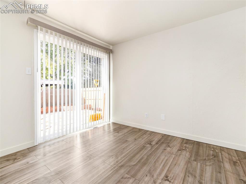 Image 14 of 28: Unfurnished room featuring light wood finished floors and baseboards