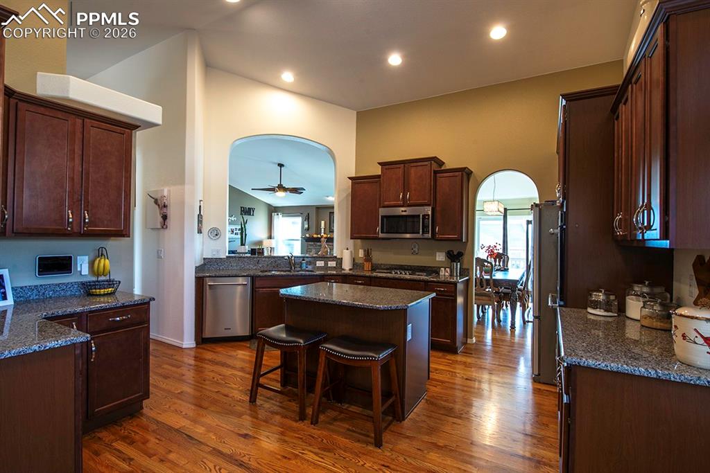 Image 16 of 47: Kitchen with opening to see living room