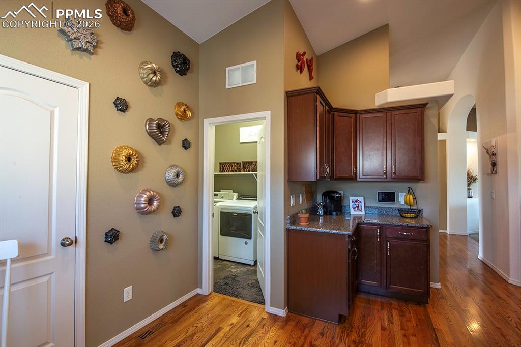 Image 19 of 47: Laundry room access and Garage access from kitchen