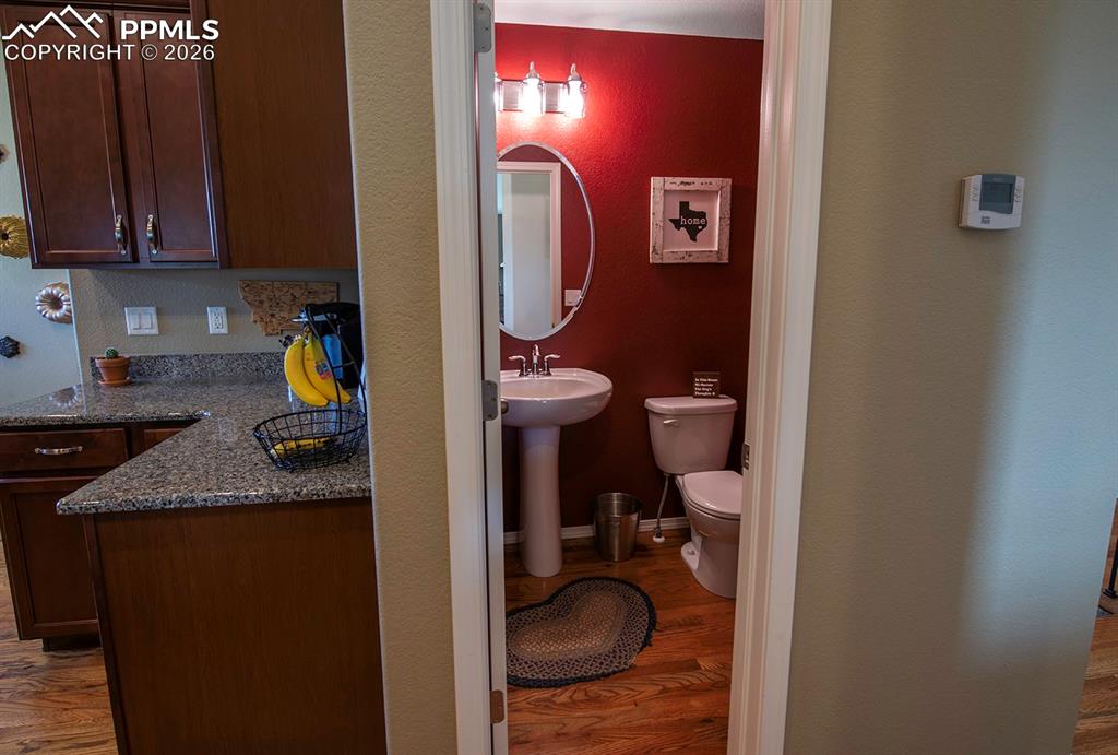 Image 21 of 47: Bathroom off kitchen