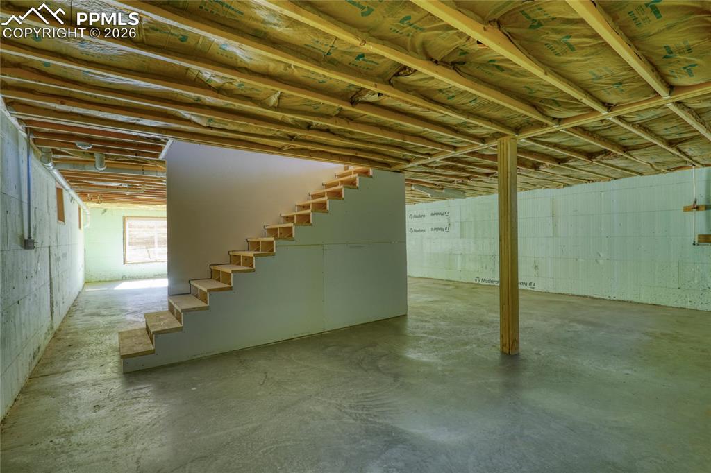 Image 43 of 50: Below grade area featuring stairs