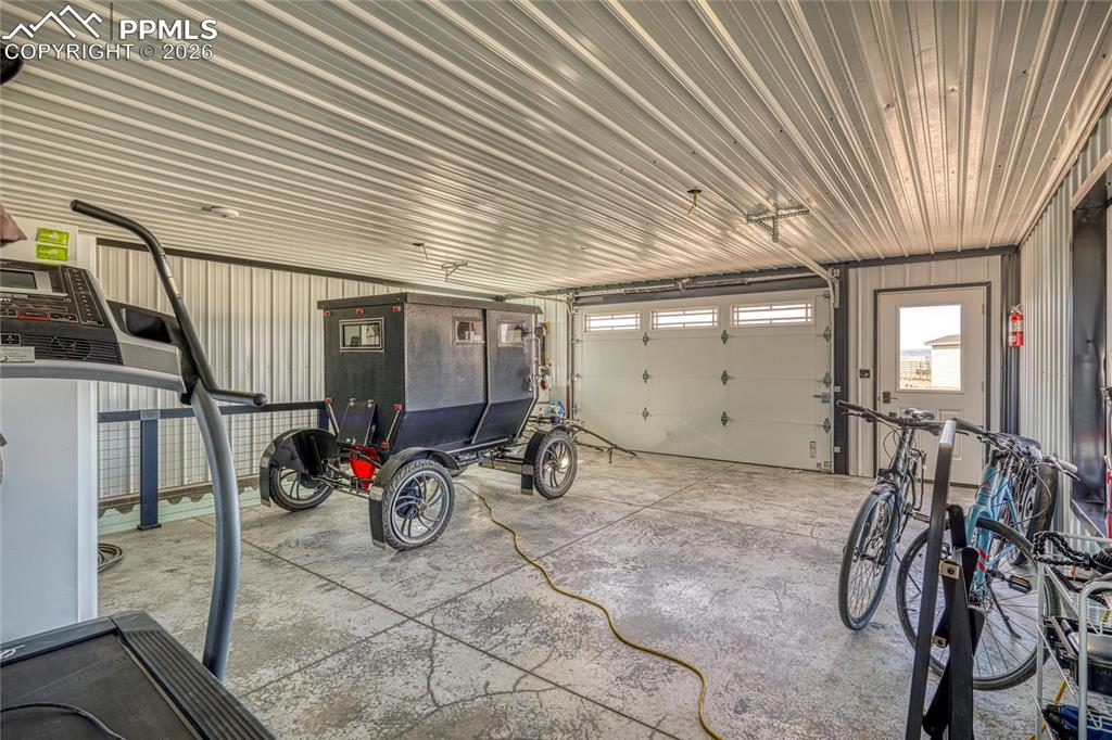 Image 46 of 50: Garage with metal wall