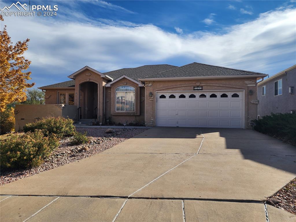 Image 2 of 49: Ranch-style home featuring a garage