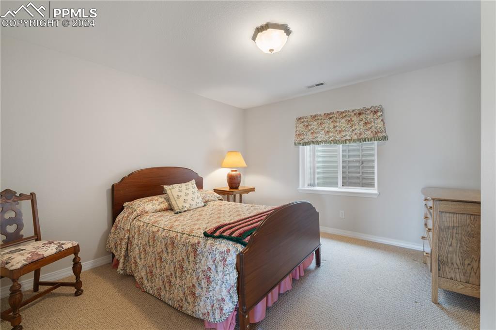 Image 36 of 49: View of carpeted bedroom
