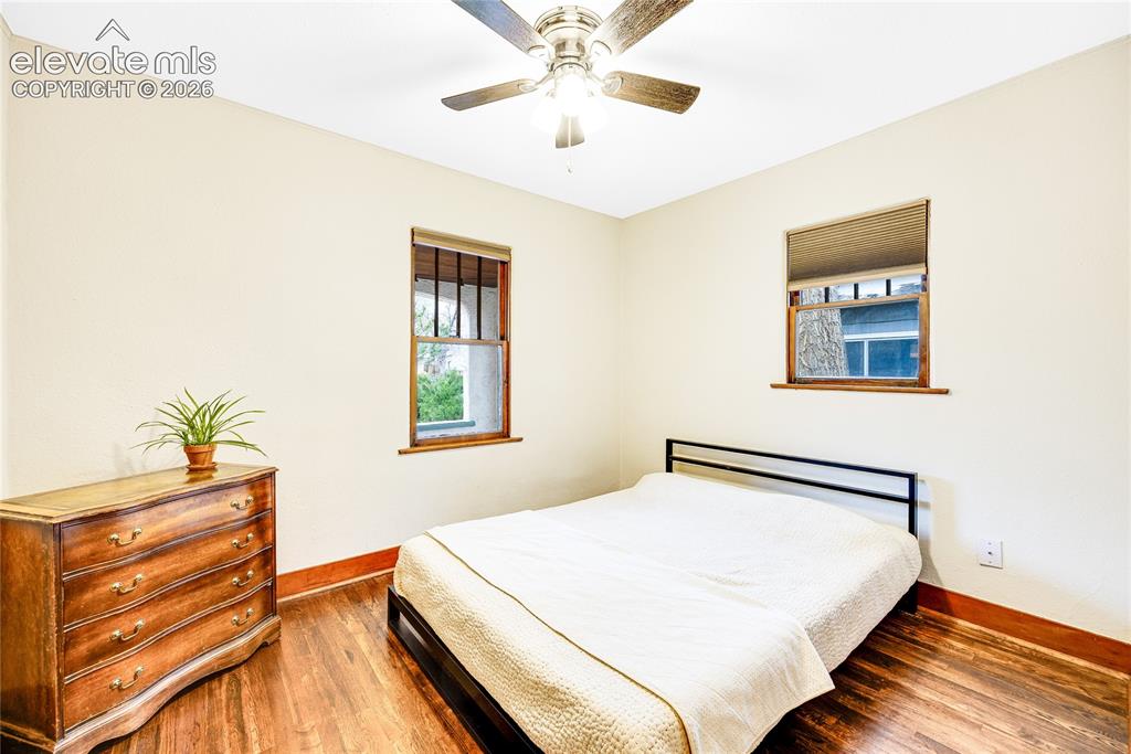 Image 12 of 33: Hardwood flooring, painted walls, ceiling fan with integrated lighting, and