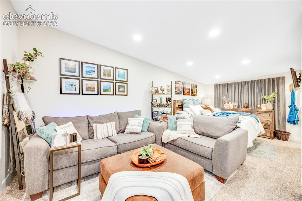 Image 24 of 33: ADU/Cottage -Recessed lighting, light-colored walls, and carpeted flooring